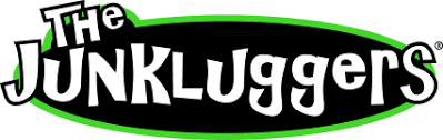 Playful black oval with green outline and bold white text reading “The Junkluggers.”